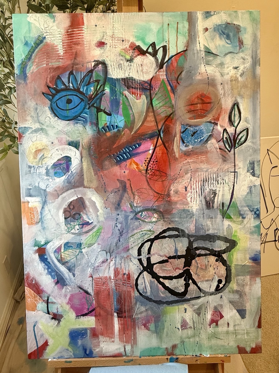 Layered pink and blue composition with eye and botanical motifs